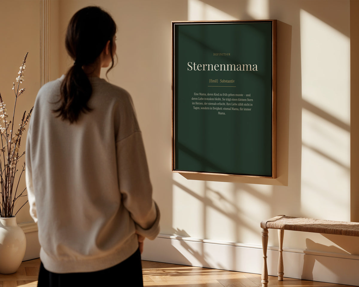 "Sternenmama" (Definition) – framed poster held in hand